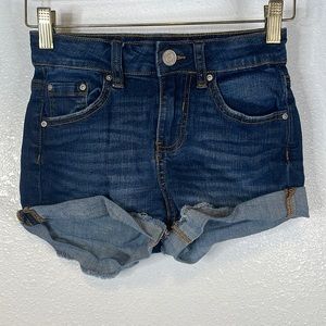 Dark washed jean shorts.